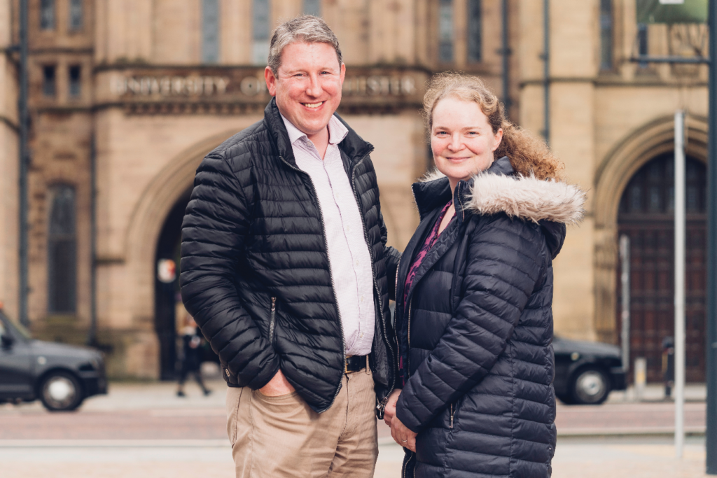 Dr Phil Crosbie and Professor Emma Crosbie smiling and staring straight at the camera