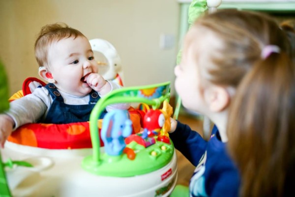 Image of newborn baby held by mother