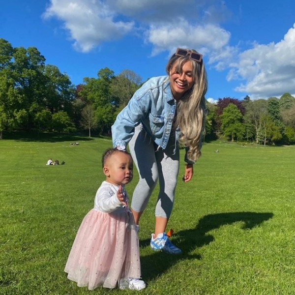 Mary and daughter Khobi walking in the park