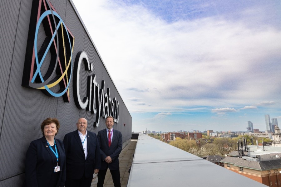 Image shows Kathy Cowell OBE DL; Group Chairman of Manchester University NHS Foundation Trust (MFT), Andy Gover; Vice President, Head of Process Excellence MDx, General Manager QIAGEN Manchester, and Professor Graham Lord; Vice-President and Dean of The University of Manchester’s Faculty of Biology, Medicine and Health, on the roof of Citylabs 2.0.